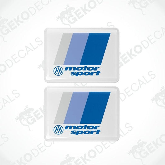 Two withe rectangular vinyl decals with the Volkswagen logo and the phrase motorsport