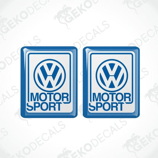 Two blue vinyl stickers with the Volkswagen logo and the word 'MOTORSPORT' printed below.