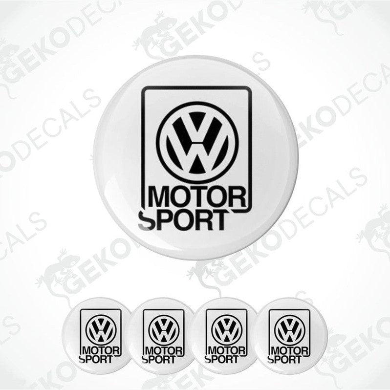 A set of four white vinyl stickers with the Volkswagen MotorSport logo in black.