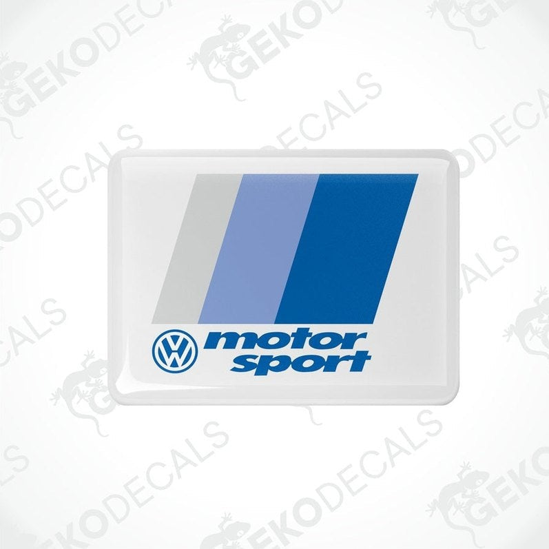 Withe rectangular vinyl decals with the Volkswagen logo and the phrase motorsport