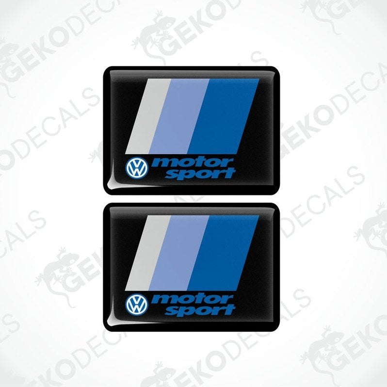 Two black rectangular vinyl decals with the Volkswagen logo and the phrase motorsport