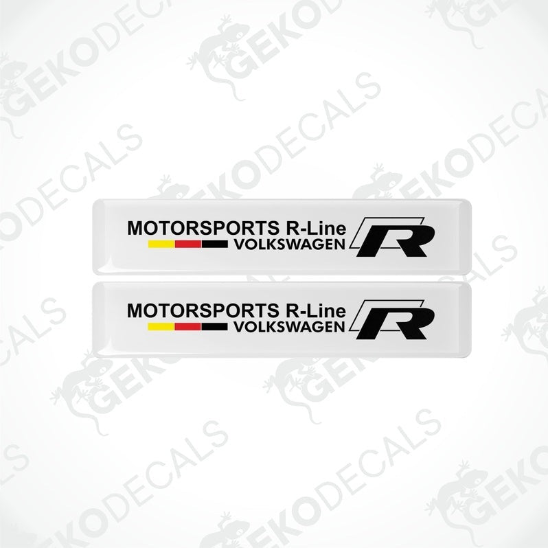 Two withe vinyl decals with the text 'MOTORSPORTS R-Line VOLKSWAGEN' and the 'R' logo in black and red.