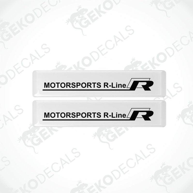 Two withe vinyl stickers with the text 'MOTORSPORTS R-LINE' printed in black.