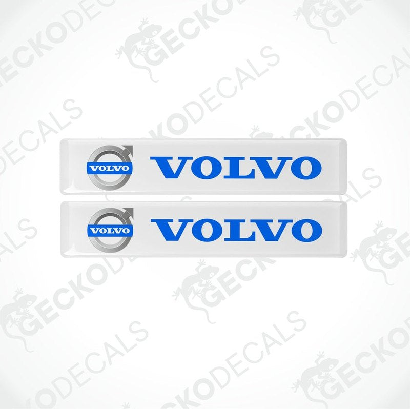 Two white rectangular car decals with the blue 'VOLVO' brand logo.