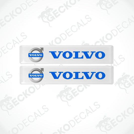 Two white rectangular car decals with the blue 'VOLVO' brand logo.