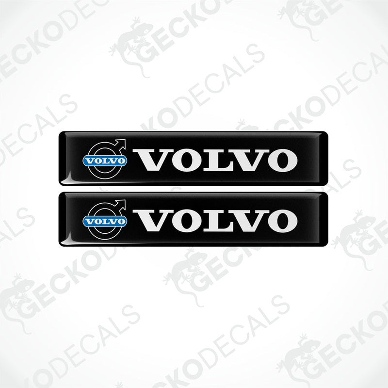 Two black vinyl decals with the white text 'VOLVO' on them, placed on a white background.