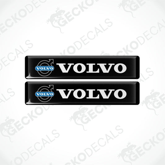 Two black vinyl decals with the white text 'VOLVO' on them, placed on a white background.