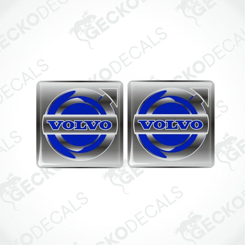 Two blue and white vinyl stickers with a Volvo brand logo.