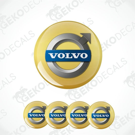 Set of Volvo logos on yellow circular backgrounds with a brand watermark.