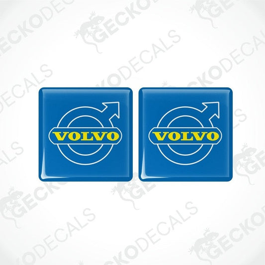 Two blue vinyl stickers with the word 'VOLVO' and a circular graphic symbol in yellow.