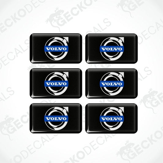A set of six black vinyl stickers with the Volvo brand logo on them.