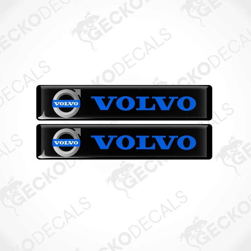 Two black rectangular car decals with the blue 'VOLVO' brand logo.