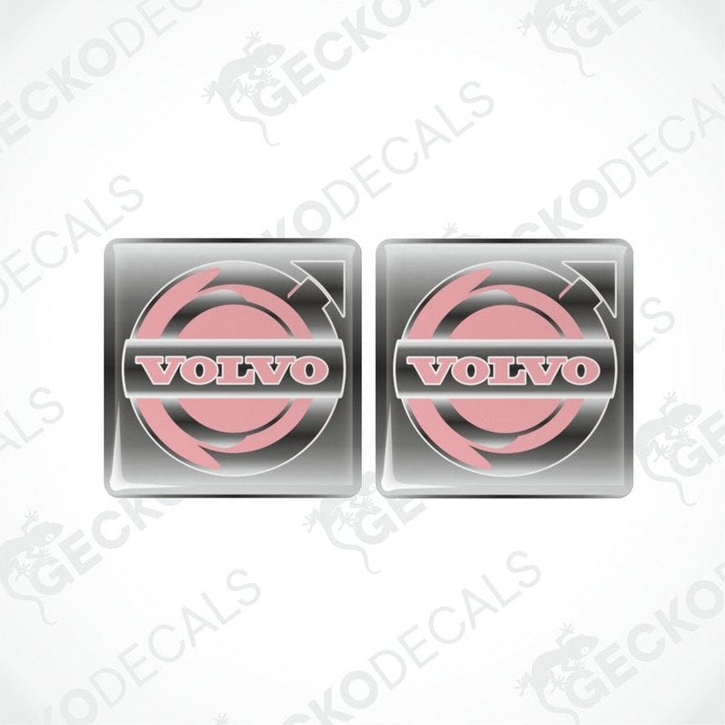 Two pink and white vinyl stickers with a Volvo brand logo.