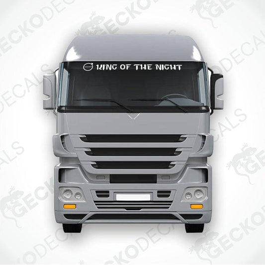 A die cut decal with the phrase 'KING OF THE NIGHT' positioned on the windscreen of a Volvo truck