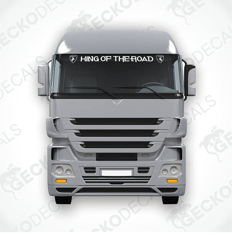 A die cut decal with the text 'KING OF THE ROAD' displayed on the upper part of a truck's windscreen.