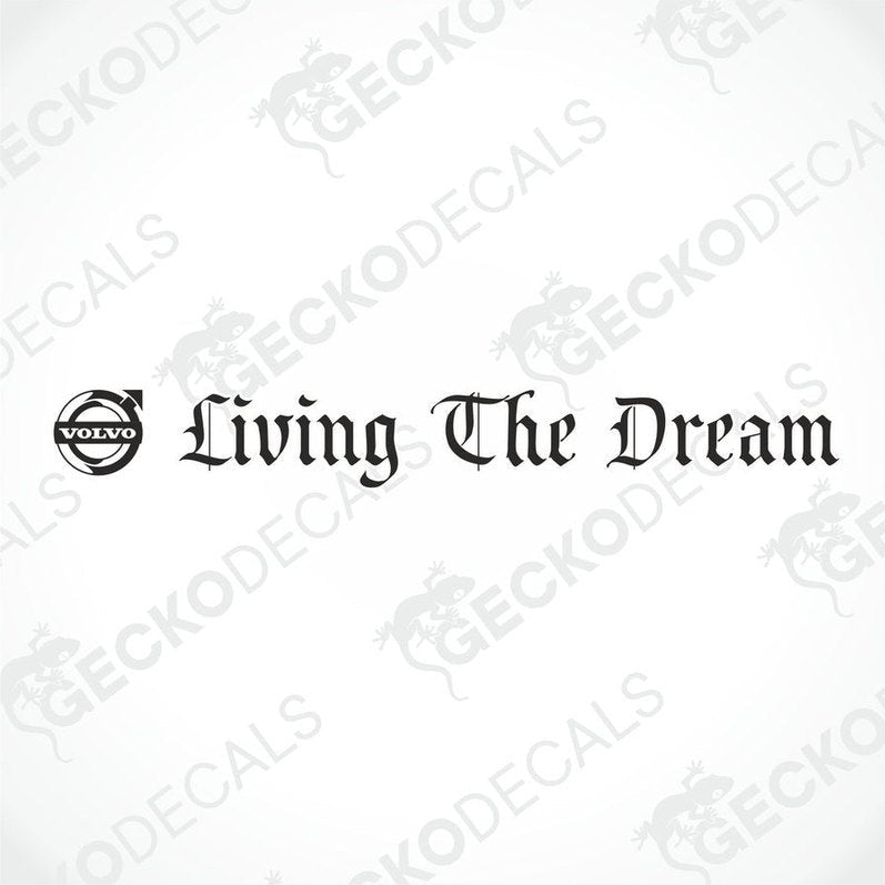 A die cut decal with the phrase 'Living The Dream' displayed on the front windscreen of a Volvo truck.