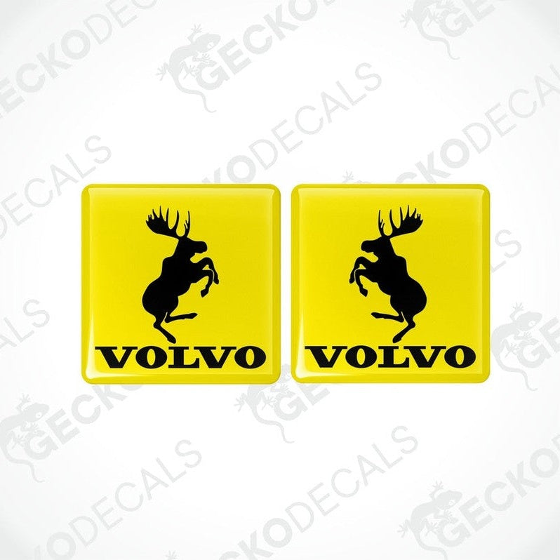 Two yellow square vinyl decals with the silhouette of a moose and the text 'VOLVO' below it.