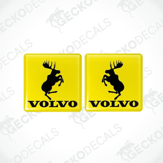 Two yellow square vinyl decals with the silhouette of a moose and the text 'VOLVO' below it.