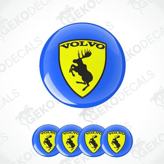 A set of vinyl decals for a Volvo vehicle, featuring a prominent round decal with the Volvo logo and moose design, and three smaller shield-shaped decals with the Volvo logo.