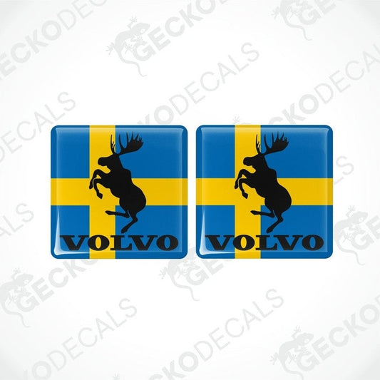 Two blue vinyl stickers with a yellow and black moose design and the Volvo brand logo.