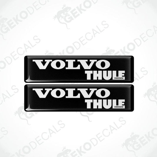 Two black vinyl stickers with the word 'THULE' and the Volvo brand logo in white.