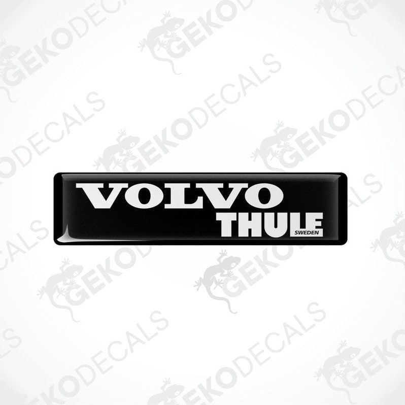 Two black vinyl stickers with the word 'THULE' and the Volvo brand logo in white.