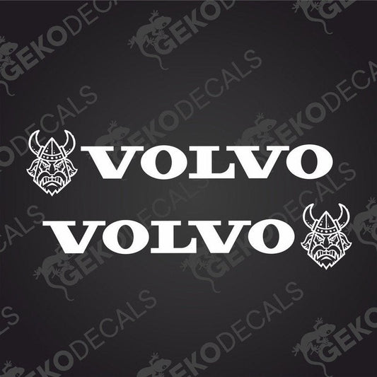 A set of two white Volvo vehicle decals, one with the brand name and a Viking helmet design, intended for use on vehicles either interior or exterior.