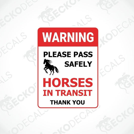 A rectangular warning sticker with a red background, featuring a white graphic of a horse and text that reads: WARNING PLEASE PASS SAFELY HORSES IN TRANSIT THANK YOU.