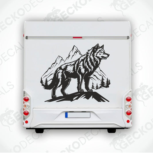 A black and white decal of a wolf in a mountainous landscape, positioned on the side of a white vehicle.