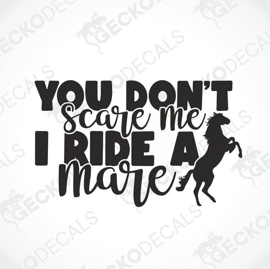 A black and white decal with the text 'YOU DON'T SCARE ME I RIDE A MARE' and a silhouette of a horse below the text.