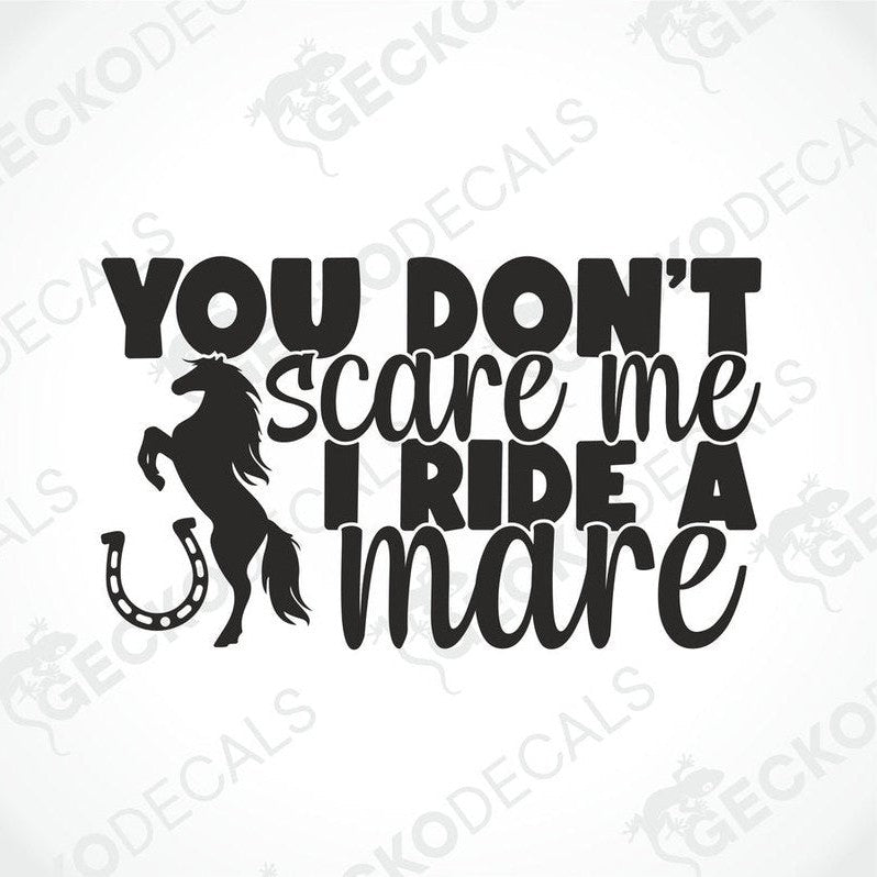 A black decal with white text that reads 'YOU DON'T SCARE ME I RIDE A MARE' with a silhouette of a horse and a horseshoe.