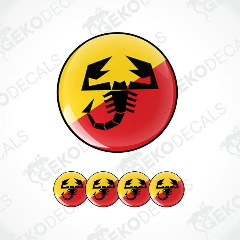 A set of four round vinyl stickers with a geometric design featuring the ABARTH logo in red, yellow, and black colors.