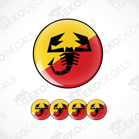 A set of four round vinyl stickers with a geometric design featuring the ABARTH logo in red, yellow, and black colors.
