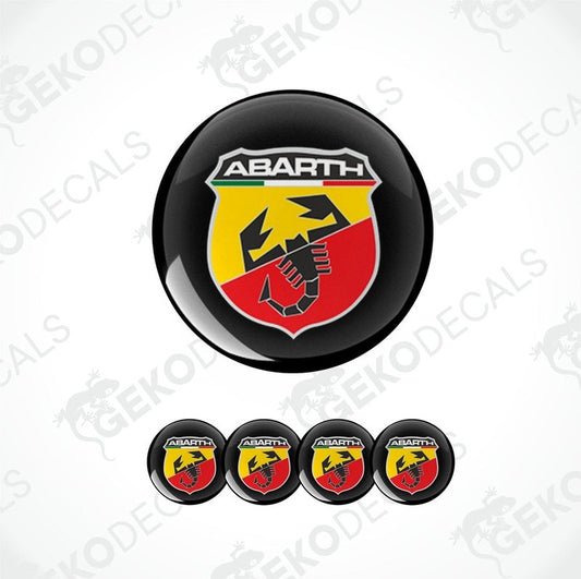 A set of four round vinyl stickers with a geometric design featuring the ABARTH logo in red, yellow, and black colors.