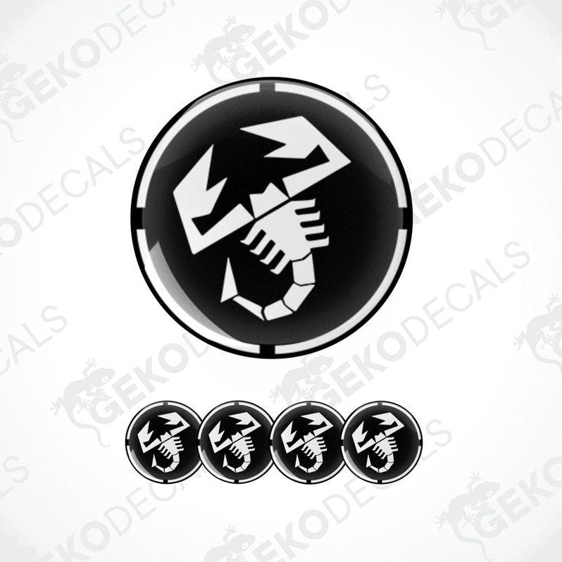 A set of black and white vinyl decals with a polyurethane coating, featuring a scorpion design, commonly associated with the Abarth brand.