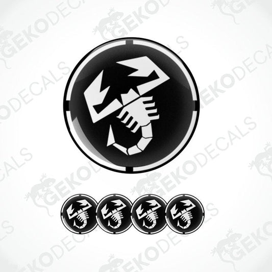 A set of black and white vinyl decals with a polyurethane coating, featuring a scorpion design, commonly associated with the Abarth brand.