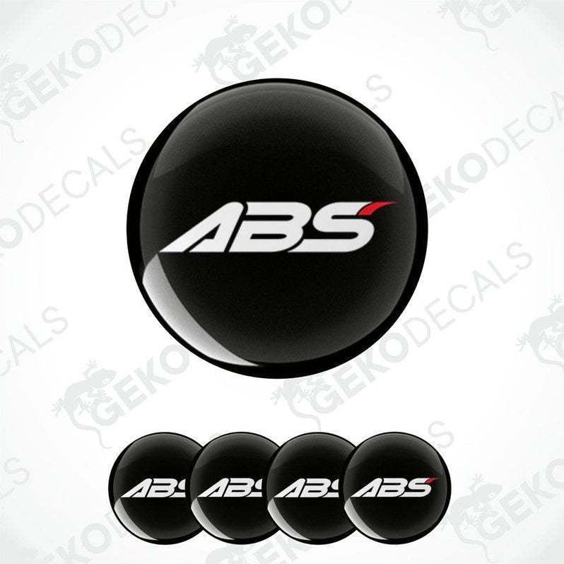 A set of four black vinyl stickers with the ABS logo printed on them.