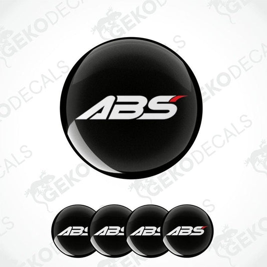 A set of four black vinyl stickers with the ABS logo printed on them.