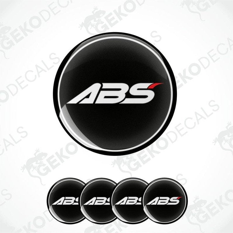 A set of four black vinyl stickers with the ABS logo printed on them.