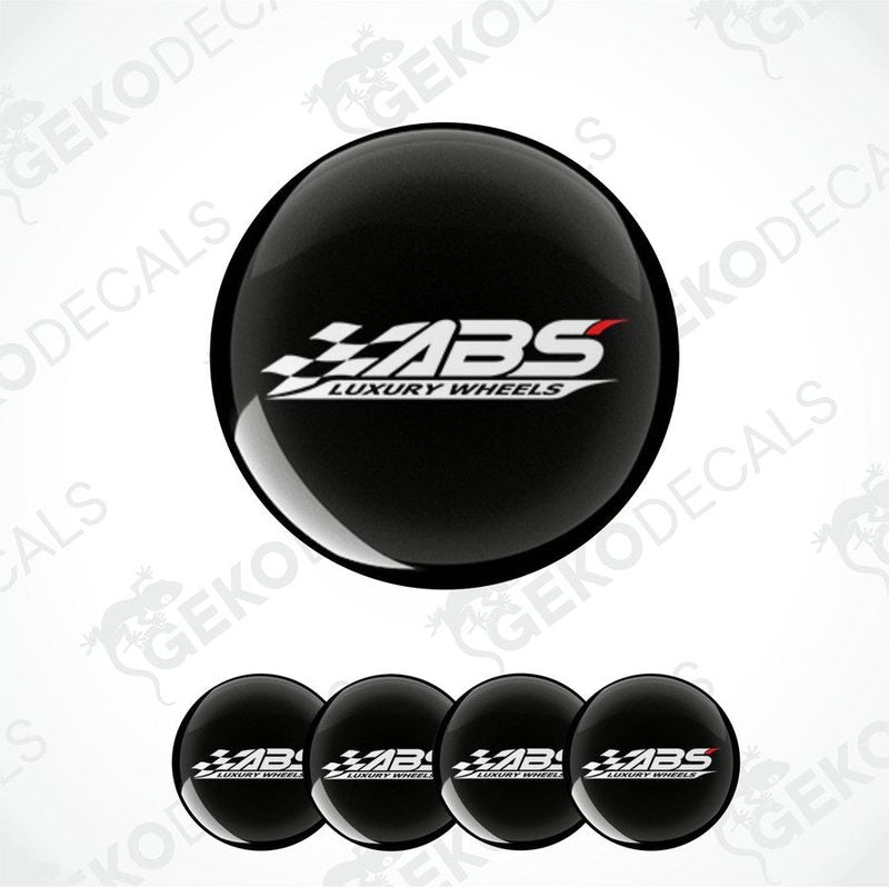 A set of four black vinyl stickers with the text 'ABS Luxury Wheels' and a logo depicting a racing flag.