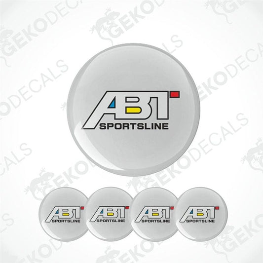 A set of round car decals with the ABT Sportsline logo in white, red, and yellow colors.