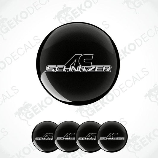 Set of four black vinyl decals with the 'AC Schnizer' logo in white, designed for use on car wheel caps.