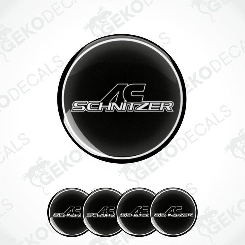 A set of four black and silver AC Schnizer vinyl decals with a polyurethane coating, designed for use as car wheel decals.