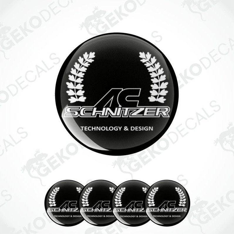 Set of four black round car decals with the AC Schnizer logo and the text 'technology & design' printed in white.