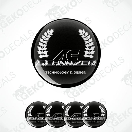 Set of four black round car decals with the AC Schnizer logo and the text 'technology & design' printed in white.