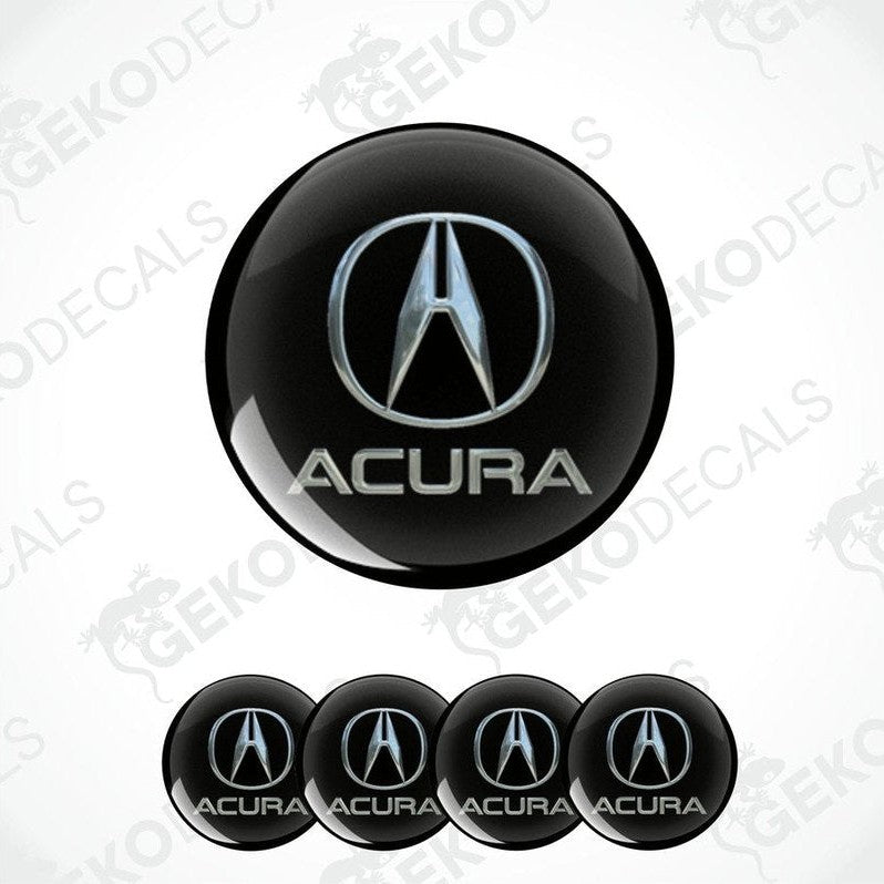 A set of four black vinyl stickers with the ACURA logo printed on them.