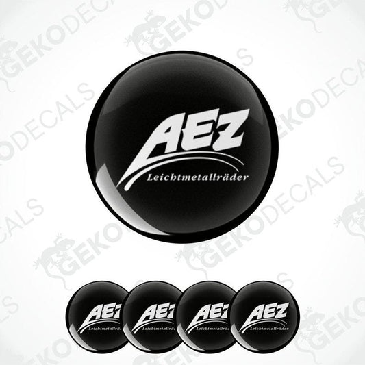 A set of four black and white vinyl decals with the AEZ LEICHTMETALLRÄDER logo.