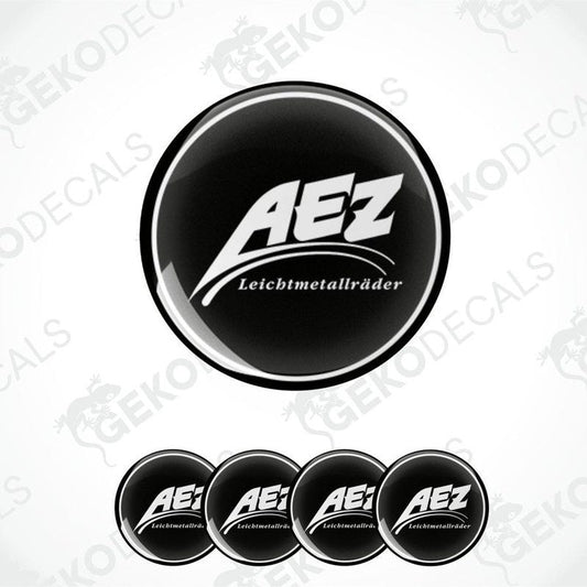 A set of four black and white vinyl decals with the AEZ LEICHTMETALLRÄDER logo.