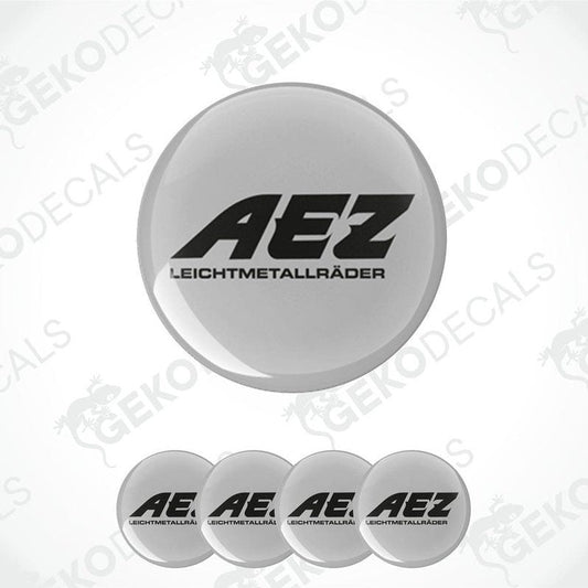 Set of four grey vinyl decals with the AEZ logo in black, designed for use on vehicle wheels.