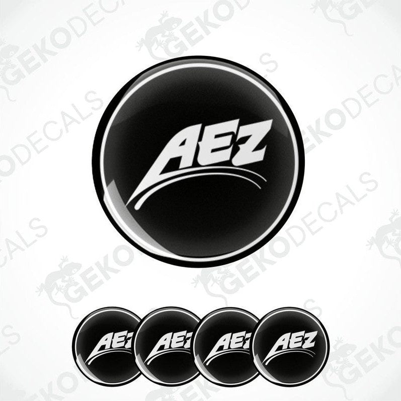 Set of four black vinyl decals with the AEZ logo in white, designed for use on vehicle wheels.